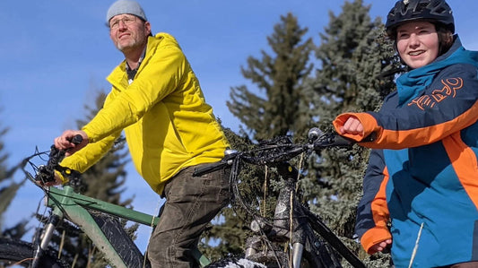 Man and Girl Riding E-Bike Outside